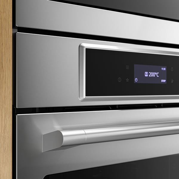 Horno de acero inoxidable con pantalla digital que muestra 200°C, mango elegante, diseño moderno.