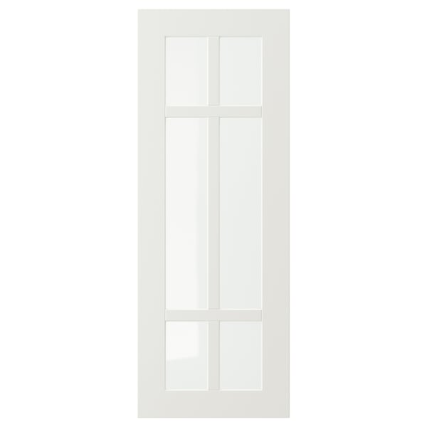 Una puerta de armario STENSUND blanca con un panel de vidrio con patrón de rejilla.