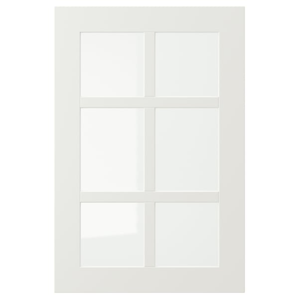 Un armario blanco STENSUND con puertas de cristal. El diseño rectangular, su atractivo de estilo rústico y su estructura robusta.