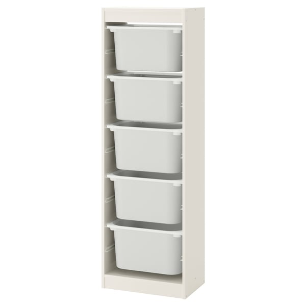 Un mueble de almacenaje TROFAST con cajones de plástico blanco sobre un marco de madera beige. Es vertical con cuatro cajones.
