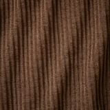 Pana marrón con gales anchos, tacto suave, textura profunda, ligeramente brillante.