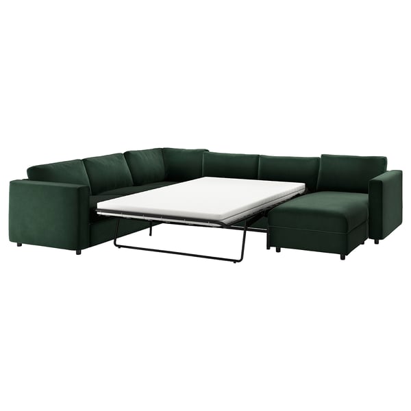 Modular VIMLE en forma de L de color verde intenso con cama nido, diseño moderno y minimalista en terciopelo reciclado.