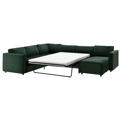 Modular VIMLE en forma de L de color verde intenso con cama nido, diseño moderno y minimalista en terciopelo reciclado.