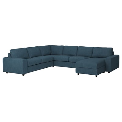 Sofá modular azul, de diseño moderno, con chaise, para mayor comodidad.