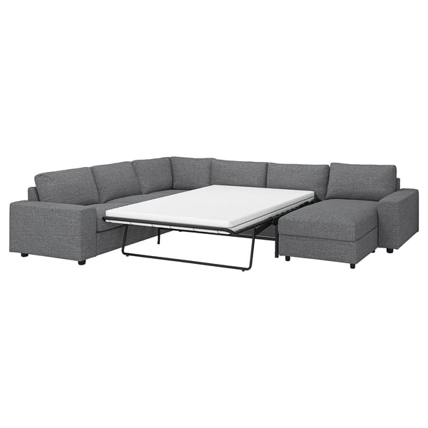 El sofá cama modular VIMLE es de color gris, con un diseño elegante y un colchón nido para mayor comodidad.