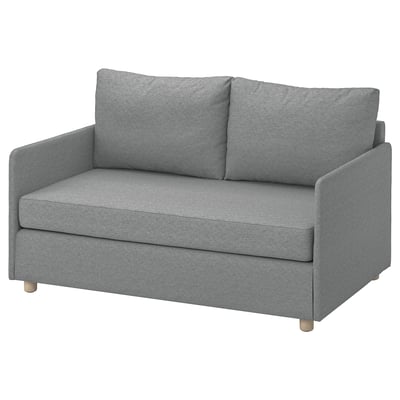 Sofá cama FRIDHULT grisa, diseinu minimalista ehun birziklatuan eta egurrean, espazio txikietarako egokia.