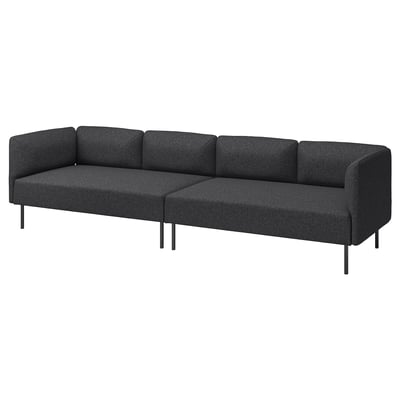 L formako sofa gris moderno modernoa, metalezko hanka ilunekin, diseinu sinplea.