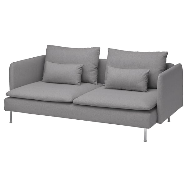 Sofa modernoa, diseinu baxu eta leunekoa, kuxin solteak, hanka altuak, tonerud bihurtua.