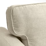 Sofa beige erosoa, jostura zehatzak, leunak, oihalezko ehundura.