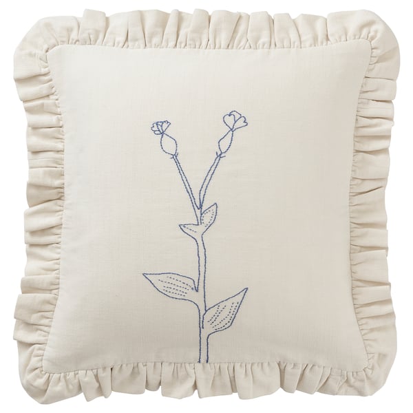 Coxín crema bordado, deseño floral azul, bordos volantes, material de algodón.