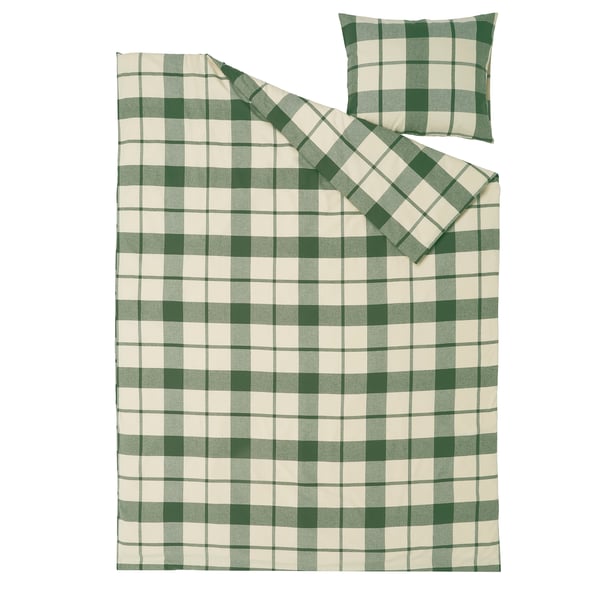 Conxunto de roupa de cama branca e verde. Unha suave cuberta de flanella de algodón e funda de almofada con peche de sobr.
