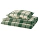 Opción: Conxunto de roupa de cama a cadros verde e branco, inclúe duvet e fundas de almofadas, dobradas ordenadamente. Feito de flanel de algodón suave e cálido.