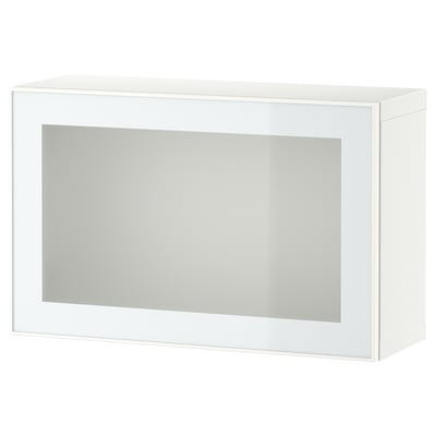 Un armario branco BESTÅ cunha porta de vidro xeado. A forma rectangular e o deseño elegante fan que sexa adecuado para solucións de almacenamento modernas.