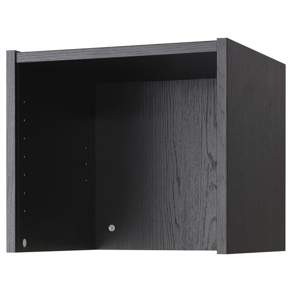 Unha extensión de libros negro BILLY. Está feito de cartón de partículas e papel de papel, cunha forma rectangular e un deseño liso.