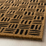 Alfombra de porta con patrán de raias atrevidas; material de coir ecolóxico, textura duradeira, deseño lúdico.