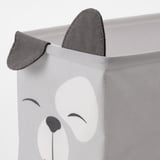 Primeiro plano dun colector de almacenamento suave e plegable cunha cara de oso bonito, perfecto para habitacións infantís.