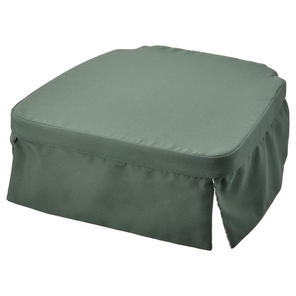 Unha almofada de cadeira verde dvargdunort cunha cor sólida e detalle de cremalleira. É rectangular e ten un deseño de saia.