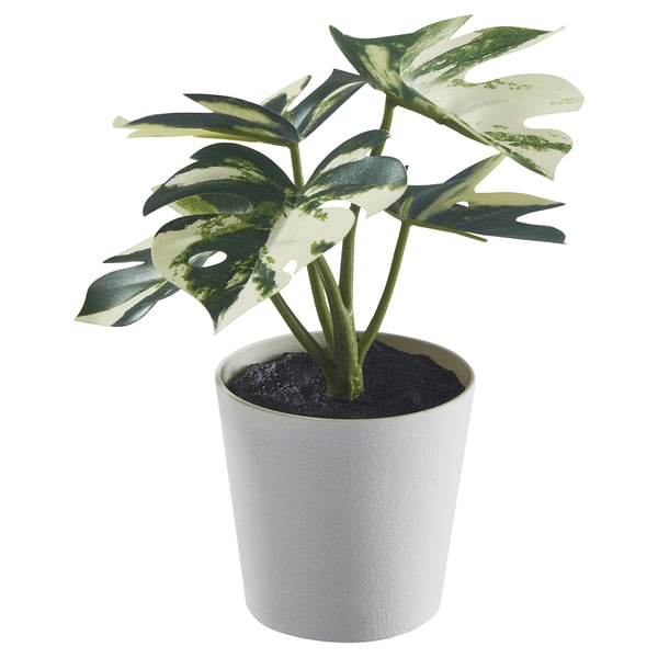 Planta branca en vaso con follas verdes, falsa, feita con materiais reciclados.