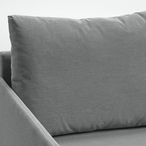 Esquina de sofá de cama de tecido gris, mostrando tapicería e deseño de calidade.