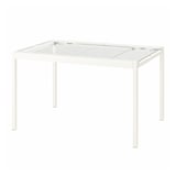 Unha mesa branca de vidro GLIVARP. O seu deseño moderno, catro patas de metal branco e unha mesa de vidro temperado transparente.