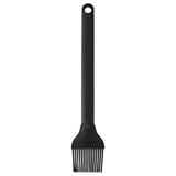 Pincel de grella de silicona negra con mango longo e burato colgante, ideal para estender líquidos en grellas.