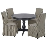 Mesa de comedor redonda negra con catro cadeiras de raias, deseño moderno, ideal para pequenos espazos.