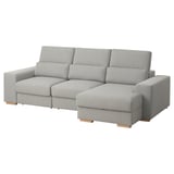 Un sofá seccional gris ISTABY cun respaldo alto, repousacabezas axustables e unha chaise lounge. Está deseñado para o confort e a relaxación.