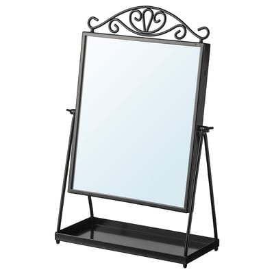 Un espello KARMSUND en negro cunha parte superior decorativa. O seu axustable, independente e unha pequena bandexa na base para o almacenamento.