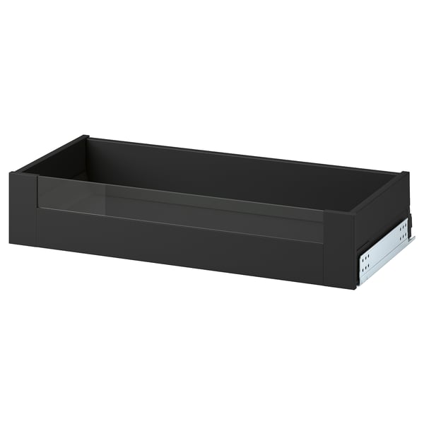 Esta imaxe mostra un caixón gris escuro KNIVSHULT, rectangular con lados lisos, ideal para almacenamento na cociña.