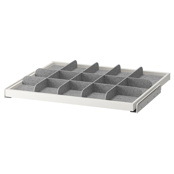 Unha bandexa extraída KOMPLEMENT con múltiples compartimentos. Taboleiro de fibra branco, divisor gris, perfecto para organizar bufandas e lazos.
