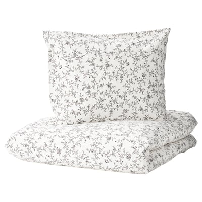 Conxunto de duvetes KOPPARRANKA, branco con patrán floral negro, mestura de algodón e viscosa para comodidade.