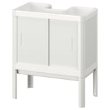 Un armario de lavabo branco LILLTJÄRN para baños pequenos, con dúas portas e catro patas.