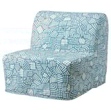 Cadeira-cama con patróns azul-verdes Lycksele con deseño xeométrico.