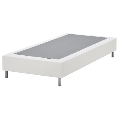 Base branca de cama LYNGÖR con patas metálicas sobre unha superficie gris.