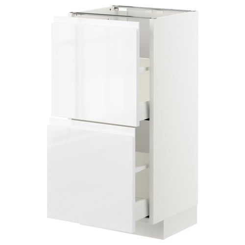 Un armario de cociña branco e moderno da serie METOD, con caixóns elegantes de alto brillo e mangos integrados.