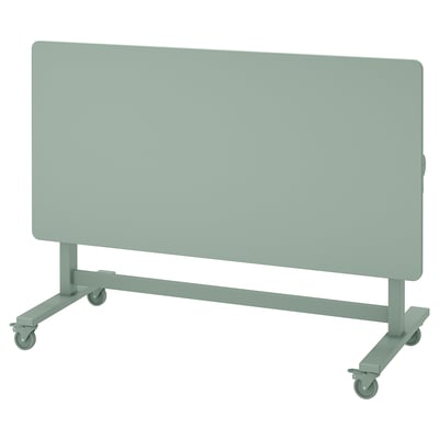 MITTZON: mesa de traballo axustable verde sobre rodas con patas dobradas, ideal para espazos flexibles.