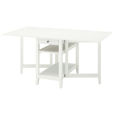 Mesa de comedor branca NÄSINGE transformable con almacenamento.