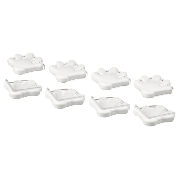 Oito parachoques de esquina brancas, deseñados para a seguridade dos nenos, mostrados en parellas con diferentes formas e materiais.