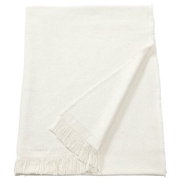 Unha manta branca e rectangular RÖNNBÄRSMAL con bordos franxados, feita cun material suave e texturizado.
