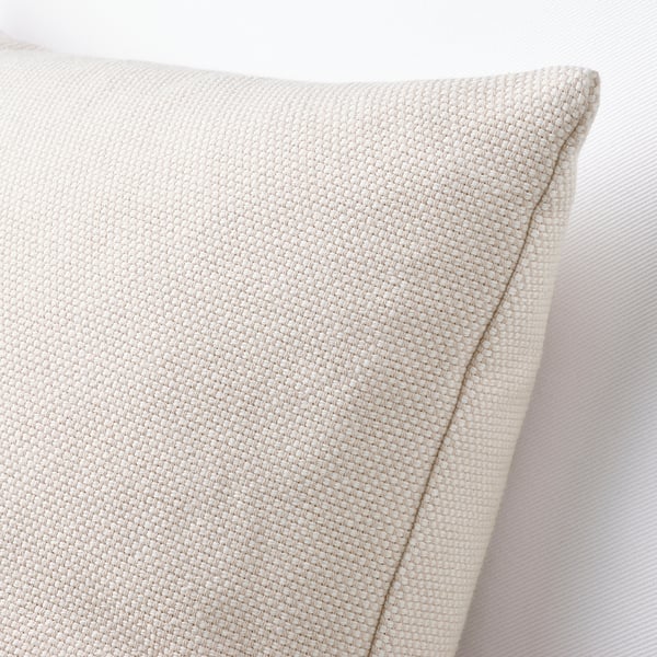 Primeiro plano de tecido acolchado beige que amosa textura de tecido e recheo gordo.
