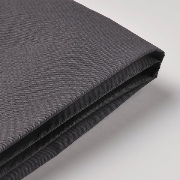 Baldaquino exterior negro dobrado en superficie clara. Tecido premium resistente aos ultravioletos con costuras duradeiras.