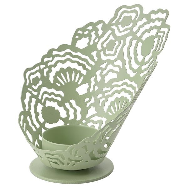 Soporte de luz de té de metal verde con recortes intrincados para efectos de sombra.
