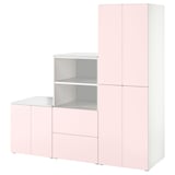 Mostra un armario SMÅSTAD rosa claro, rectangular e modular, ideal para habitacións infantís, con múltiples compartimentos para almacenar roupa.