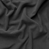 Tecido tecido gris escuro en primeiro plano, mostrando textura estreitamente tricotada e elegantes variacións de ton.