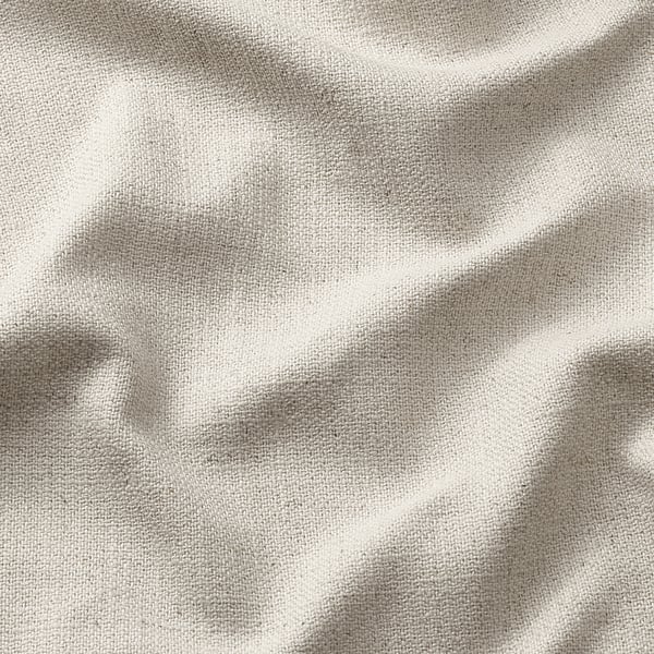 Primeiro plano de tecido beige texturizado, áreas lisas e engurradas.