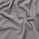 Tecido gris suave e texturizado, que amosa unha superficie lisa e peluche, ideal para cubertas de sofás acolledoras.