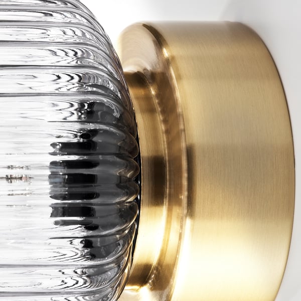 Lámpada de metal de ouro e vidro de textura clara, deseño moderno.