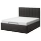 Cama negra moderna con cabeceira acolchada e almacenamento incorporado, deseño elegante.