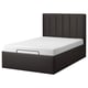 Moderna cama de plataforma negra con cabeceira acolchada, deseño elegante.