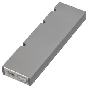 Controlador de iluminación intelixente gris rectangular TRÅDFRI con carcasa de plástico e portos de conector brancos.